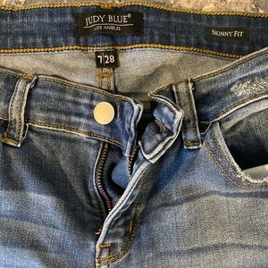 Skinny blue jeans distressed with leopard patches, like new they were worn twice